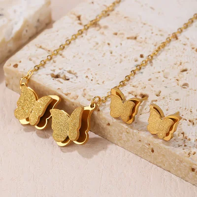 Brincos de aço inoxidável com design de borboleta dupla conjunto de joias para mulheres